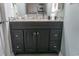 Bathroom with gray vanity, marble countertop, and decorative mirror at 2001 S Ocean Blvd. S # 1013, Myrtle Beach, SC 29577