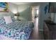 Serene bedroom with seaside-inspired decor offers a comfy bed and access to the bathroom and living area at 2001 S Ocean Blvd. S # 1013, Myrtle Beach, SC 29577