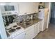 Efficient kitchen featuring appliances, granite countertops, and mosaic backsplash at 2001 S Ocean Blvd. S # 1013, Myrtle Beach, SC 29577