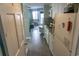 Efficient kitchen with white appliances, mosaic backsplash, and views into the living area at 2001 S Ocean Blvd. S # 1013, Myrtle Beach, SC 29577