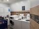Well-equipped laundry room with multiple washers, dryers, and tiled accents for residents' convenience at 2001 S Ocean Blvd. S # 1013, Myrtle Beach, SC 29577