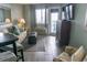 Inviting living room features tile flooring, a view to the balcony, and comfortable seating at 2001 S Ocean Blvd. S # 1013, Myrtle Beach, SC 29577