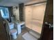 Bathroom featuring tiled floors, vanity area, and glass-enclosed shower at 2100 Sea Mountain Hwy. # 520, North Myrtle Beach, SC 29582