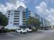 Harbourgate Resort condo building featuring ample parking and blue accents at 2100 Sea Mountain Hwy. # 520, North Myrtle Beach, SC 29582