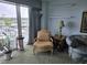 Cozy living room with balcony access offering scenic water views at 2100 Sea Mountain Hwy. # 520, North Myrtle Beach, SC 29582