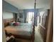 Bedroom with a four-poster bed, dresser, and natural light at 2100 Sea Mountain Hwy. # 520, North Myrtle Beach, SC 29582