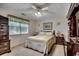 Comfortable bedroom with a queen bed, side tables, and a window with natural light at 220 Gateway Dr., Little River, SC 29566