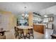 View of the dining area leading to the kitchen and living room, with plenty of natural light at 220 Gateway Dr., Little River, SC 29566