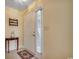 Welcoming entryway with a decorative rug, side table, and ample natural light at 220 Gateway Dr., Little River, SC 29566