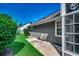 Home exterior featuring tidy landscaping, neutral gray siding, and a concrete patio at 220 Gateway Dr., Little River, SC 29566