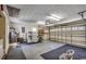 Spacious garage with storage, workbench, and roll-up door to the backyard at 220 Gateway Dr., Little River, SC 29566