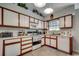 Well-lit kitchen featuring white cabinetry, modern appliances, and ample counter space at 220 Gateway Dr., Little River, SC 29566
