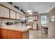 Bright eat-in kitchen with white cabinets, updated appliances, and a view of the backyard at 220 Gateway Dr., Little River, SC 29566