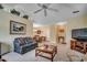Bright living room with comfortable seating, dining area, and entertainment center at 220 Gateway Dr., Little River, SC 29566