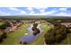 Beautiful aerial view showcasing a luxurious golf course community with a central clubhouse and water features at 223 Atlantic Breeze St., Myrtle Beach, SC 29572
