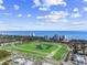 Scenic aerial view of green golf course with ocean view and resort buildings, showcasing the coastal lifestyle at 223 Atlantic Breeze St., Myrtle Beach, SC 29572