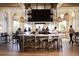 Upscale bar area in a restaurant with stylish decor, pendant lights, and patrons enjoying food and drinks at 223 Atlantic Breeze St., Myrtle Beach, SC 29572