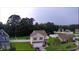 Aerial view of the property shows a well-manicured lawn and a peaceful neighborhood pond at 236 Haley Brooke Dr., Conway, SC 29526