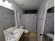 Well-lit bathroom featuring a large mirror, modern fixtures, and colorful unicorn accents at 236 Haley Brooke Dr., Conway, SC 29526