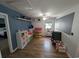 Spacious bedroom with wood floors, white ceiling fan, and decorative shelves at 236 Haley Brooke Dr., Conway, SC 29526