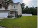 Charming two-story home boasts a spacious front yard, stone accents and welcoming porch at 236 Haley Brooke Dr., Conway, SC 29526