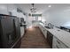 This modern kitchen features white cabinets and a granite countertop with stainless steel appliances at 236 Haley Brooke Dr., Conway, SC 29526