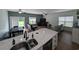Open-concept living area seamlessly blends the kitchen, dining, and living spaces for modern living at 236 Haley Brooke Dr., Conway, SC 29526