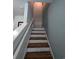 Beautiful staircase with hardwood steps and white risers and a handrail at 236 Haley Brooke Dr., Conway, SC 29526