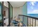 Relax on this balcony overlooking the beach with seating and serene ocean views at 2401 S Ocean Blvd. # 1262, Myrtle Beach, SC 29577