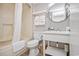 Full bathroom with shower, toilet, and sink with gray tile, creating a relaxing atmosphere with essential amenities at 2401 S Ocean Blvd. # 1262, Myrtle Beach, SC 29577