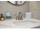 Close up on bathroom vanity featuring gray tiled backsplash, white countertop, and modern fixtures, creating a stylish and serene space at 2401 S Ocean Blvd. # 1262, Myrtle Beach, SC 29577