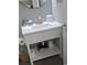 Bathroom vanity with white countertop, open shelving and stylish fixtures, providing functional storage and a modern aesthetic at 2401 S Ocean Blvd. # 1262, Myrtle Beach, SC 29577