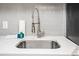 Close-up of a stainless steel kitchen sink with modern faucet and white countertop at 2401 S Ocean Blvd. # 1262, Myrtle Beach, SC 29577