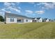 Backyard view featuring a spacious lawn and the home's rear exterior at 250 Six Mile Creek Dr., Georgetown, SC 29440