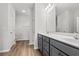 Bathroom featuring double sinks with dark cabinets and a large mirror at 250 Six Mile Creek Dr., Georgetown, SC 29440