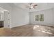Inviting bedroom with tray ceilings, wood floors, and a large window with natural light at 250 Six Mile Creek Dr., Georgetown, SC 29440
