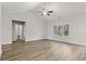 Spacious main bedroom featuring wood floors, a ceiling fan, and a large window with natural light at 250 Six Mile Creek Dr., Georgetown, SC 29440