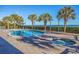 Inviting outdoor pool and hot tub area with ocean view surrounded by mature palm trees at 2504 N Ocean Blvd. # 1730, Myrtle Beach, SC 29577