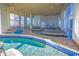 Indoor lazy river style pool with blue tiles, large windows, and brick floors at 2504 N Ocean Blvd. # 1730, Myrtle Beach, SC 29577