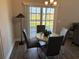 Cozy breakfast nook with table, chairs, and sliding glass doors leading to the backyard at 2594 W Shore Dr., Longs, SC 29568