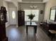Elegant dining room featuring hardwood floors, a modern chandelier, and a glass-top table at 2594 W Shore Dr., Longs, SC 29568