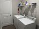 Functional laundry room featuring modern appliances and ample shelving for storage at 2594 W Shore Dr., Longs, SC 29568