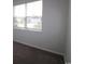 Bright bedroom featuring a large window and neutral carpet at 2681 Ophelia Way, Myrtle Beach, SC 29577