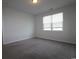 Bright bedroom with a large window and neutral carpet at 2681 Ophelia Way, Myrtle Beach, SC 29577