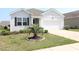 Charming single-Gathering home with a well-manicured lawn, mature landscaping, and an attached two-car garage at 2681 Ophelia Way, Myrtle Beach, SC 29577