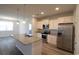 Well-lit kitchen with white cabinetry, granite countertops, stainless steel appliances, and center island at 2681 Ophelia Way, Myrtle Beach, SC 29577