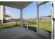 Relaxing screened-in porch overlooking a well-manicured lawn and a community of homes at 2681 Ophelia Way, Myrtle Beach, SC 29577