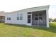 Exterior view of screened-in porch, providing an indoor-outdoor living space and backyard access at 2681 Ophelia Way, Myrtle Beach, SC 29577