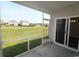 Screened-in porch offers a serene view of the lush green backyard and neighboring houses at 2681 Ophelia Way, Myrtle Beach, SC 29577