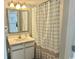 Bathroom with vanity, mirror, and shower featuring a polka-dot shower curtain at 2801 S Ocean Blvd. # 1535, North Myrtle Beach, SC 29582